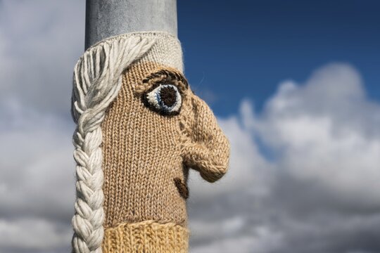 Knitting art or guerrilla knitting, lamppost, Bl&ouml;ndu&oacute;s, Nor&eth;urland, Iceland