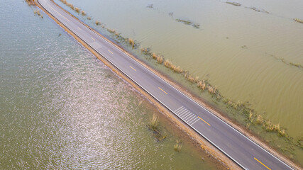 road with water on both sides