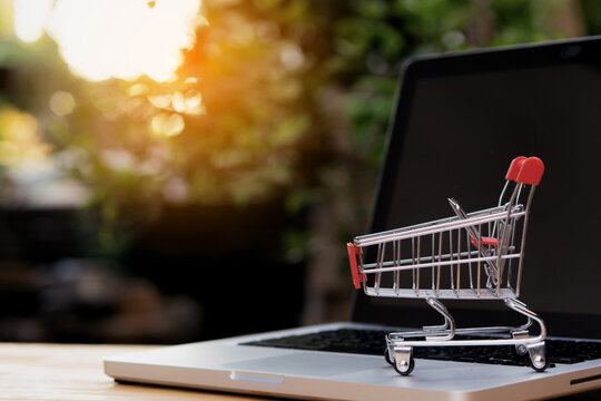 Shopping online. empty shopping cart or trolley on laptop keyboard. Shopping service on The online web. offers home delivery