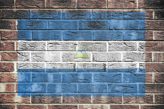 Nicaragua flag on old brick wall background