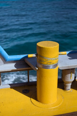 Naklejka premium yellow mooring post on boat deck