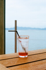 refreshing drink on table with sea view