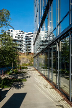 Contemporary architecture and urban housing visualized through wide angle framing over green areas in the loren district of Oslo, Norway, emphasizing modern development