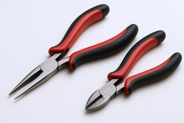 Obraz premium Two Pliers: Long Nose Pliers and Side Cutting Pliers Tools with Red and Black Handles on White Background