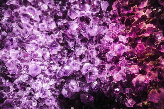 Vibrant amethyst crystal cluster with rich purple hues and densely packed geometric formations - Powered by Adobe