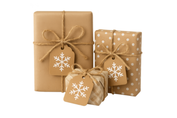 Three brown gift boxes tied with twine and snowflake tags, one polka-dot present