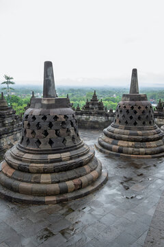 Borobudur Indonesia 12 11 2025 &ndash; Iconic stone stupas under cloudy rainy skies at the ancient temple near Yogyakarta in Java.