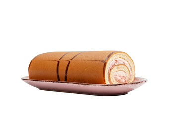 Swiss roll cake with strawberry cream on a pink dessert plate, isolated on white. Side view of an uncut sponge roll with chocolate stripes.