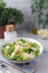 A bowl with classic Caesar salad	