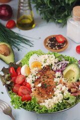 A bowl with cobb salad, traditional American dish	