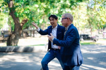 Diverse business professionals discussing work outdoors during informal meeting