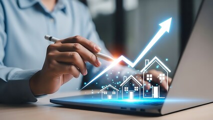 Business person analyzing real estate growth chart on laptop screen