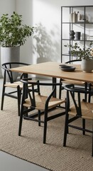 Fototapeta premium Modern dining area with wishbone chairs and plant
