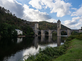 Fototapeta premium View of the Valentrén bridge, in the medieval city of Cahors, over the Lot River. Lot Valley, Ocitanie Region, France.
