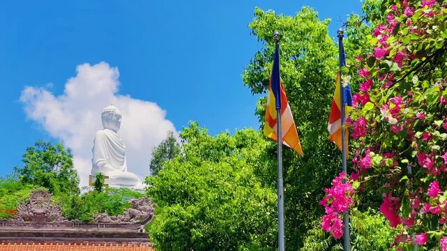 Nha Trang, Vietnam - September 18, 2025. Chua Long Son Pagoda with a large white Buddha statue in the vast, clear blue sky. The main Buddhist temple of Kien Giang Province. 4К	
