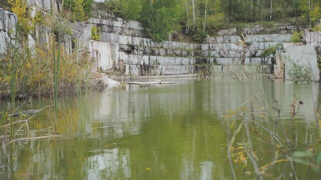 Petelinsky marble quarry. An old marble quarry filled with water. Hand held. Siberia.

