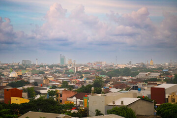 Obraz premium City panorama from above aerial skyline view of urban architecture, buildings, and the sea