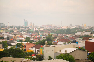 Obraz premium City panorama from above aerial skyline view of urban architecture, buildings, and the sea