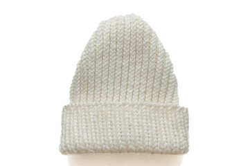 White hand-knitted wool hat for women on white background.