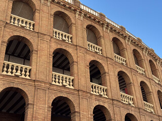 Historic Bullring in Valencia, Spain Under a Sunny Blue Sky