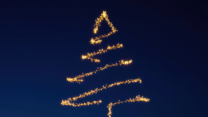 Creative sparkler art forms a glowing Christmas tree against a dark night sky during a festive celebration