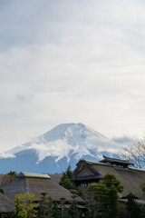 Oshino Hakkai Heritage Village, Old Japanese village with Mount Fuji in background. Mt. Fujisan view from traditional houses, Yamanashi, Japan.