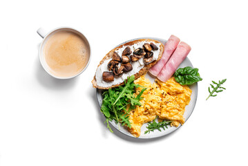 Healthy balanced breakfast with scrambled eggs, sandwich, ham