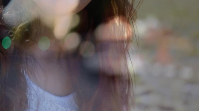 Student holding acoustic guitar, camera pulling back revealing grin, bokeh lifting music mood