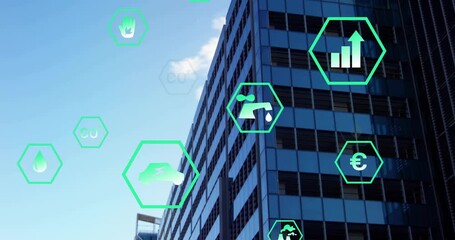 Modern glass office building receiving green hex AR icons from left, visualizing energy metrics