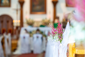 Wedding Church Aisle With Pink Flowers And Soft Bokeh Lighting Creating Romantic Ceremony Atmosphere