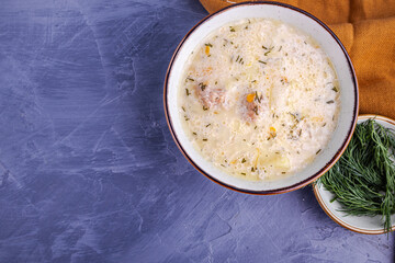 Homemade creamy fish soup with dill