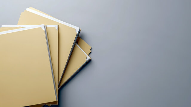 A stack of light brown Manila folders with white papers inside, fanning out from the left against a gray background