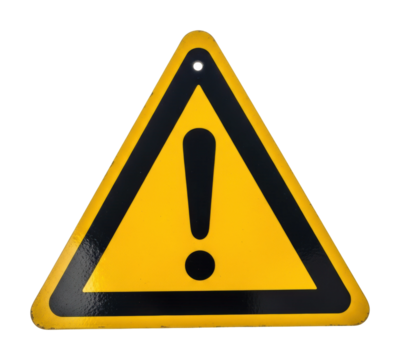 Caution sign alerting drivers of hazards on road urban environment