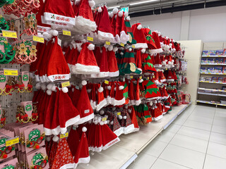 Christmas season shopping for santa and elf hats in festive holiday store display