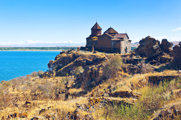 View of Lake Sevan and medieval Armenian monastery - Hayravank. Gegharkunik Province, Armenia