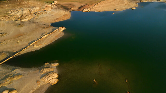 Aerial Lake Patterns with Sand and Rock at Almendra Reservoir
