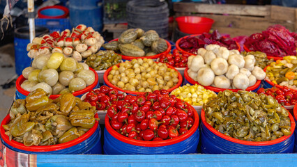 Vibrant Assortment of Pickled Vegetables in Buckets at Farmers Market in Turkey