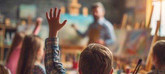 Child Raising Hand in Art Class with Teacher Holding Paintbrush in Warm Lighting