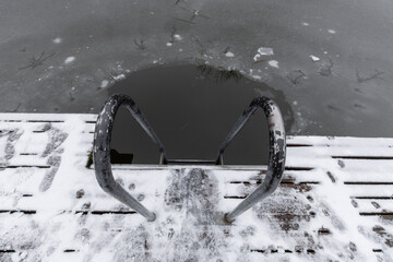 Metal Ladder Entering Dark Hole