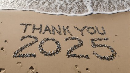 Fototapeta premium Thank You 2025 Message on Beach Sand with Approaching Wave.