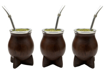 three richly stained dark wooden yerba mate gourds with intricate silver bombillas, professionally photographed on a transparent background. concept of authentic south american tradition