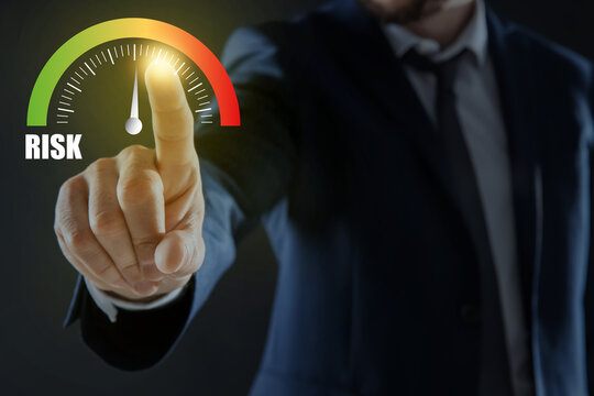 Man regulating level of risk on virtual screen against black background, closeup - Powered by Adobe