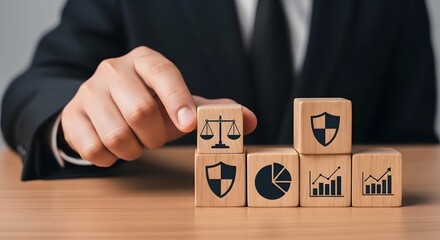 Naklejka premium Business professional arranging wooden blocks with legal, security, data symbols