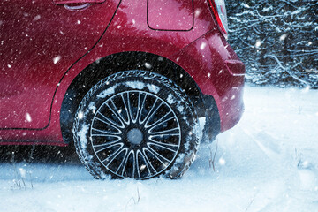 Car on snowy country road, closeup. Adverse weather conditions © New Africa