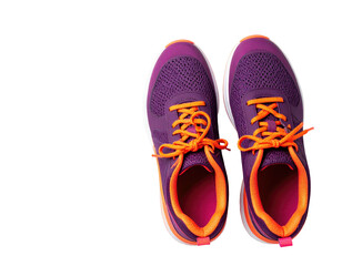 Pair of purple running shoes with orange laces, isolated on a solid black background