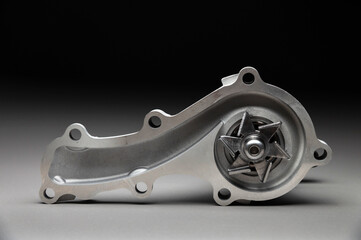 New spare part on a gradient gray background7 Internal combustion engine cooling system pump