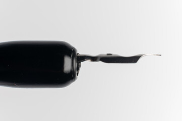 Fountain pen with removable ink cartridge shown during installation, on white