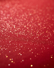 Shimmer glitter dust red background festive sparkle bokeh luxury paper texture gold speck soft blur elegant mood holiday glow warm light dreamy vibe