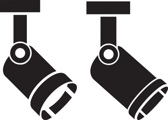 Two adjustable track lighting fixtures silhouette