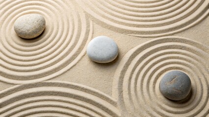 Zen sand garden with smooth stones and circular raked patterns
